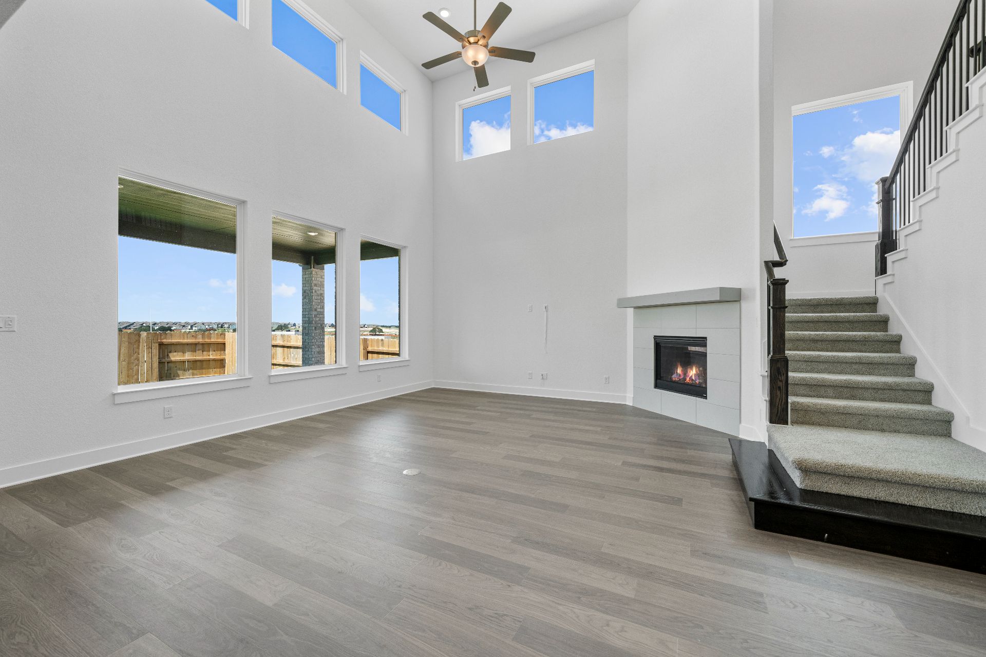 820 South Hemingway Loop Liberty Hill, TX 78642 - Photo 13 of 35 Family Room with soaring ceiling & fireplace