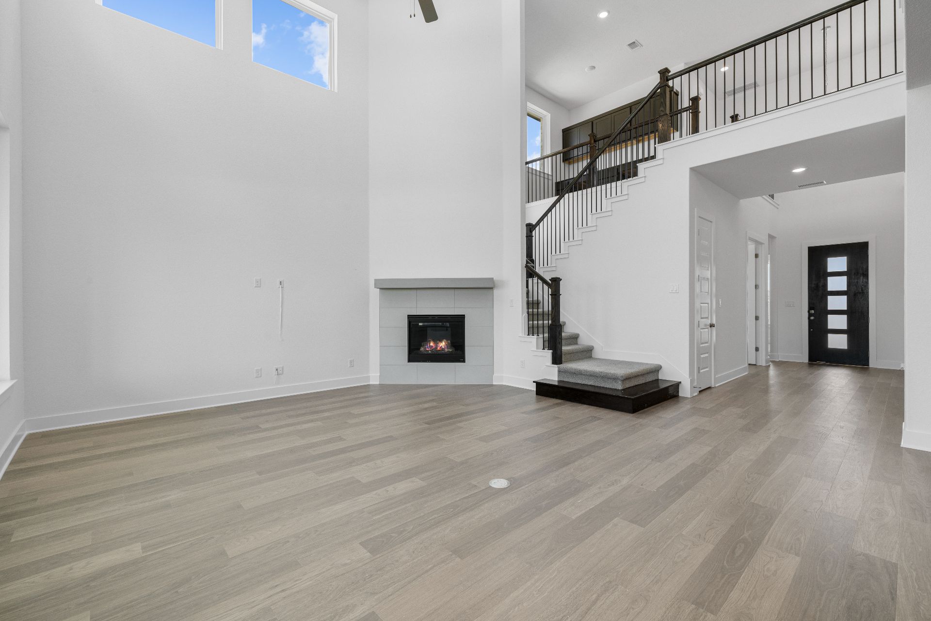 820 South Hemingway Loop Liberty Hill, TX 78642 - Photo 14 of 35 Family Room with soaring ceiling & fireplace