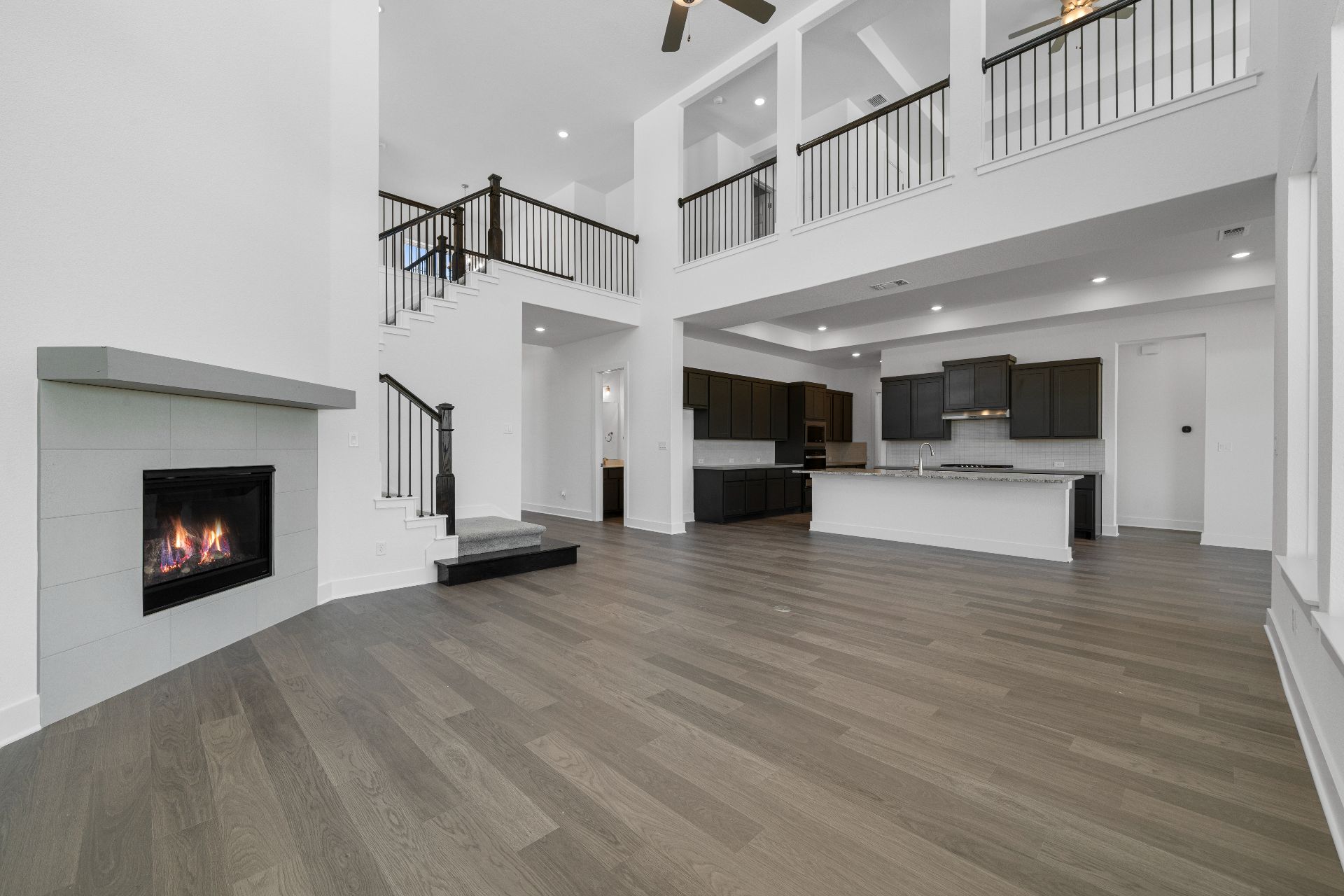 820 South Hemingway Loop Liberty Hill, TX 78642 - Photo 15 of 35 From Family Room to Open Concept Kitchen