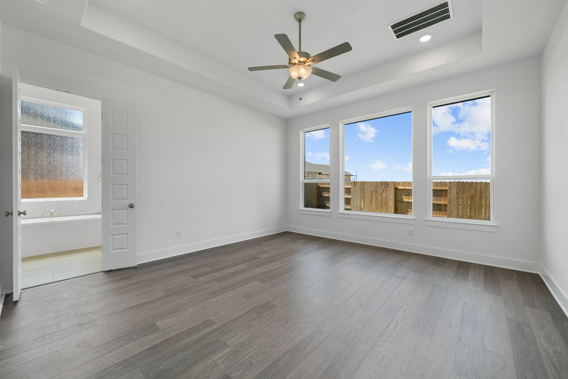 820 South Hemingway Loop Liberty Hill, TX 78642 - Photo 16 of 35 Primary Bedroom with tray ceiling