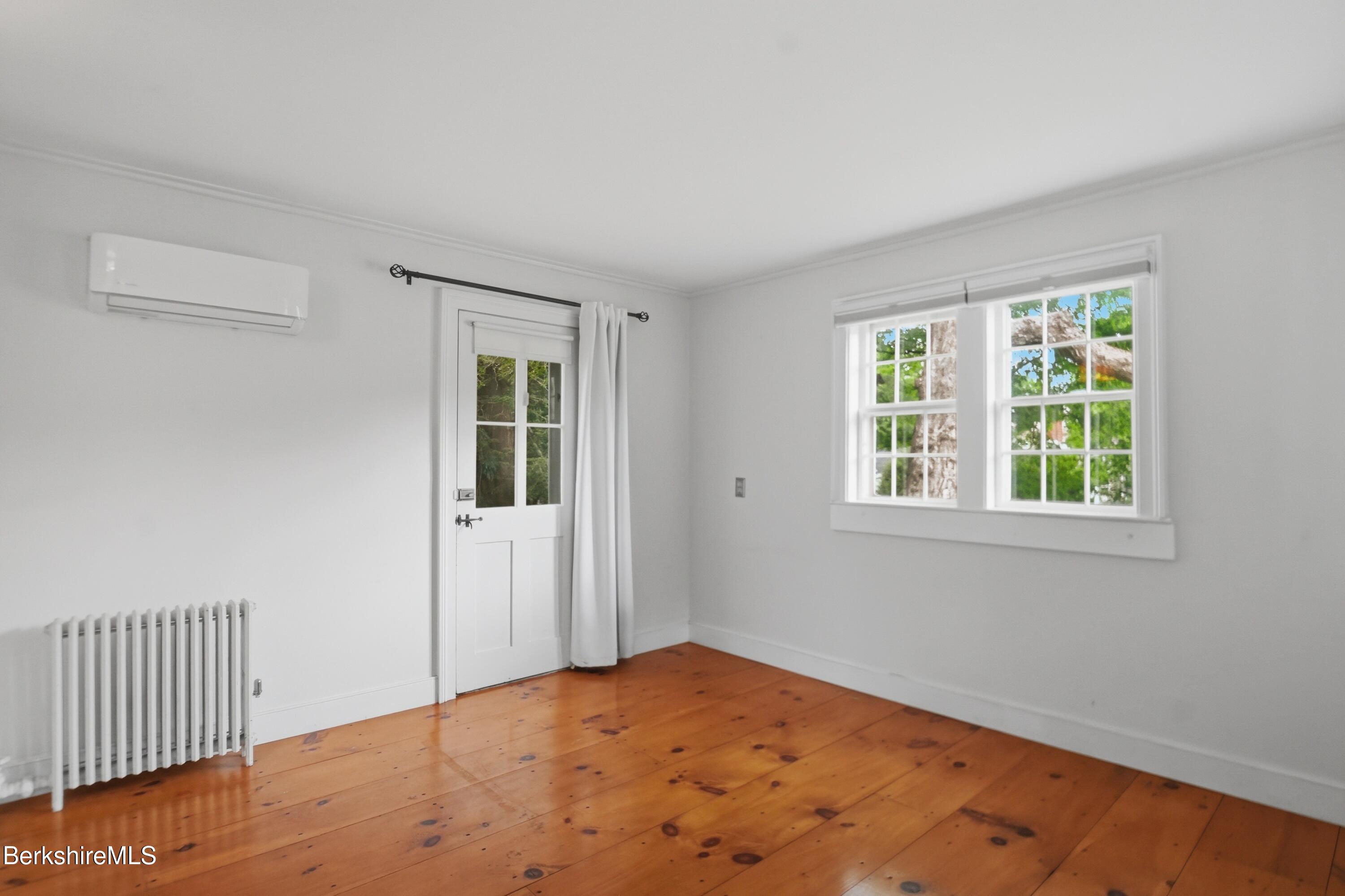 4 Stockbridge Road West Stockbridge, MA 01266 - Photo 20 of 94 a view of an empty room with wooden floor and a window