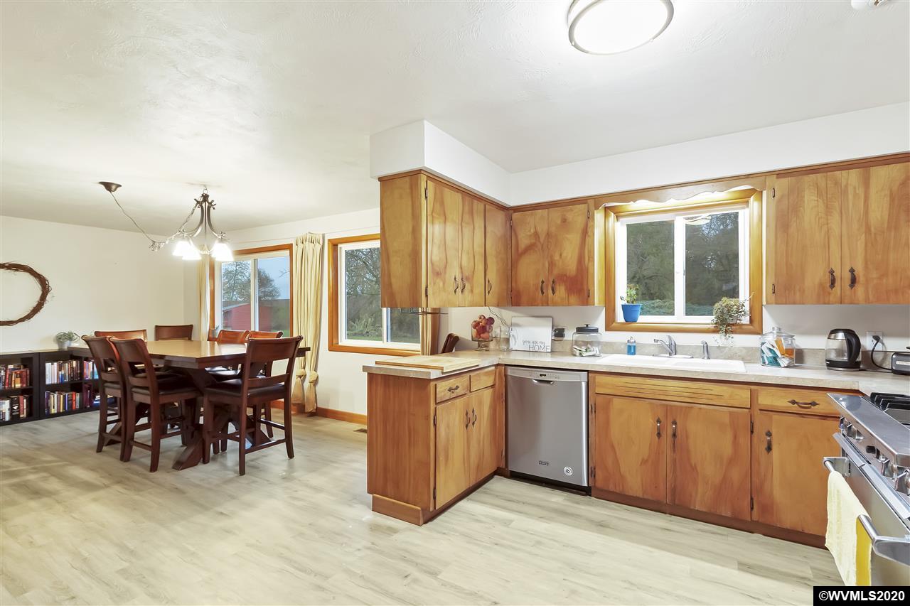8290 Rickreall Road Rickreall, OR 97371 - Photo 8 of 40 a large kitchen with lots of table and chairs