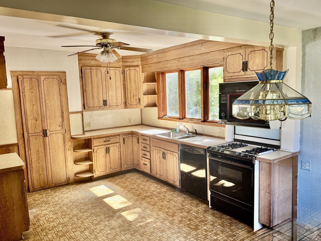 25 Hummock Road Quincy, MA 02171 - Photo 12 of 28 a kitchen with a stove and a sink