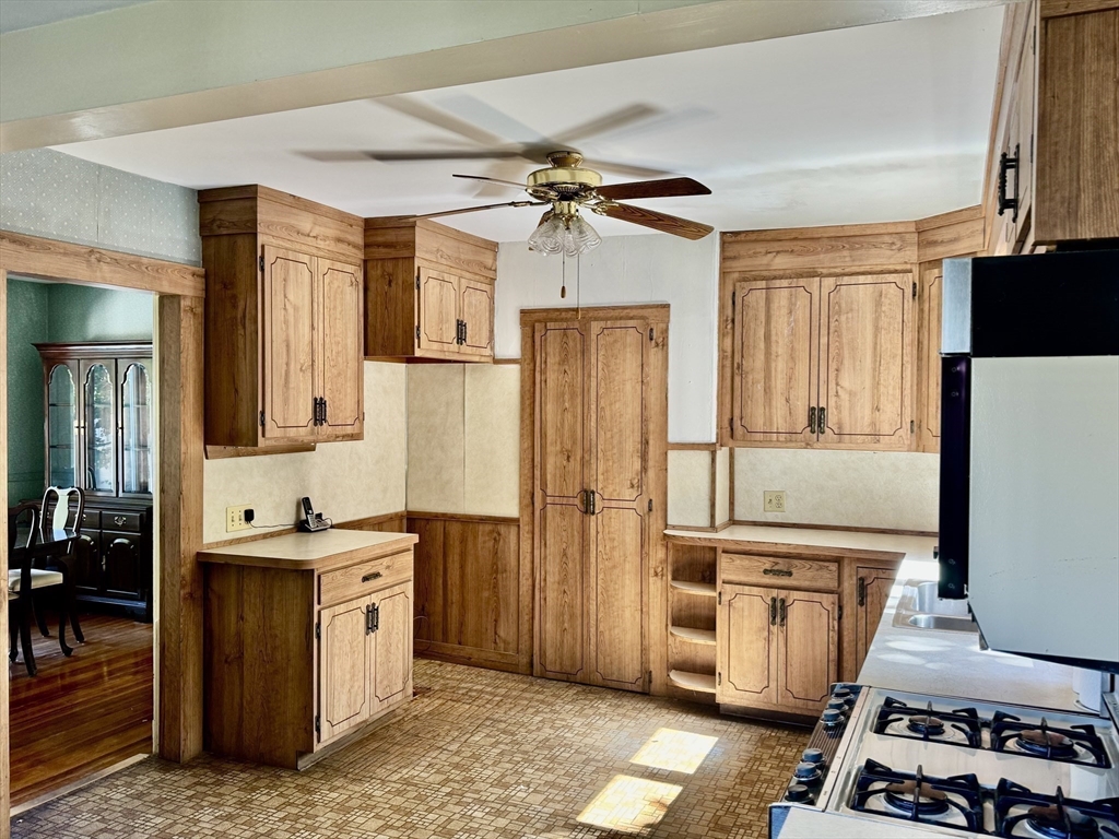 25 Hummock Road Quincy, MA 02171 - Photo 13 of 28 a kitchen with stainless steel appliances a stove a refrigerator a cabinets and wooden floor
