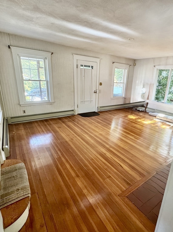 25 Hummock Road Quincy, MA 02171 - Photo 5 of 28 a view of empty room with window and wooden floor