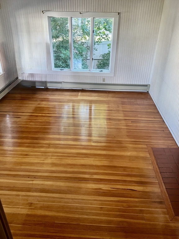 25 Hummock Road Quincy, MA 02171 - Photo 6 of 28 a view of a room with wooden floor and a window