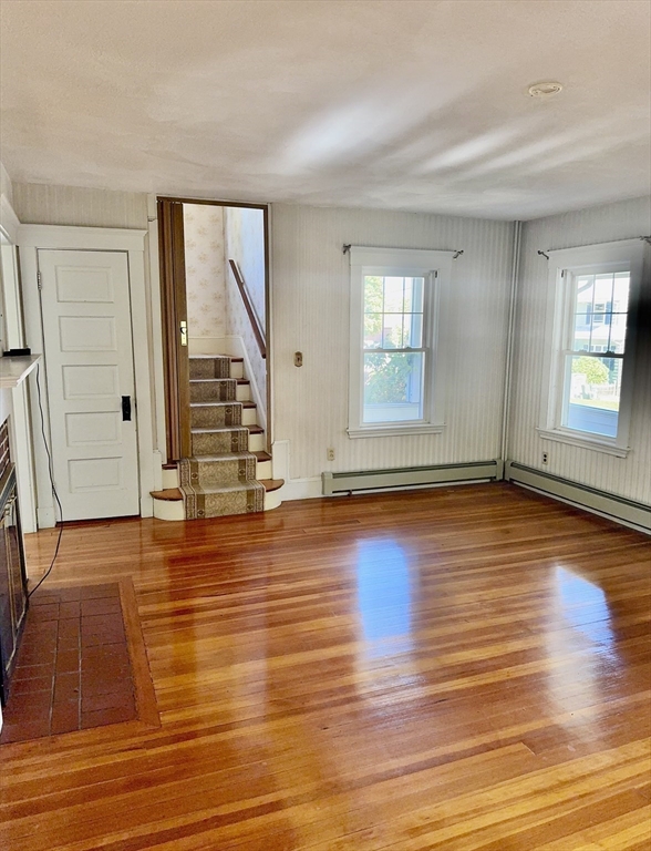 25 Hummock Road Quincy, MA 02171 - Photo 8 of 28 a view of empty room with wooden floor and fan