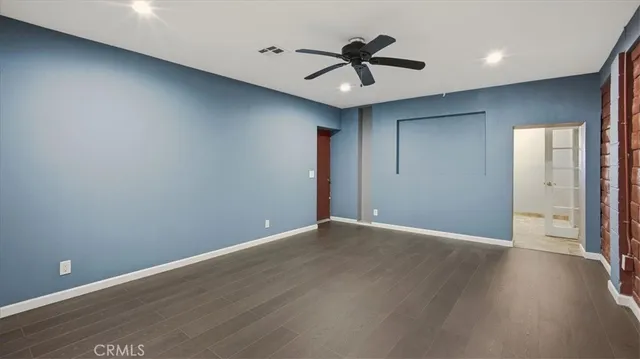 a bedroom with furniture and window