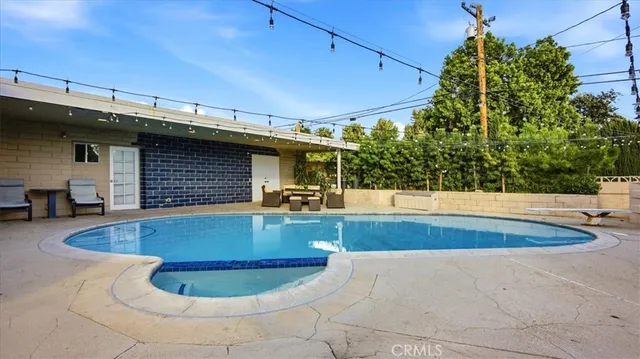 an aerial view of a house with swimming pool
