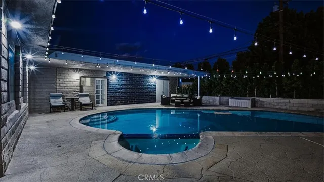 a kitchen with stainless steel appliances wooden cabinets and a table