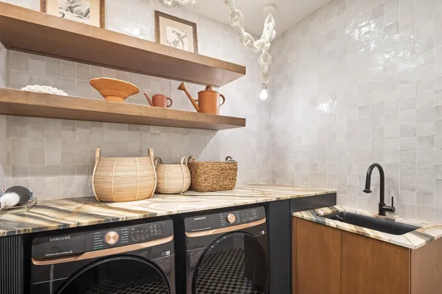 a spacious bedroom with a bed and a couch