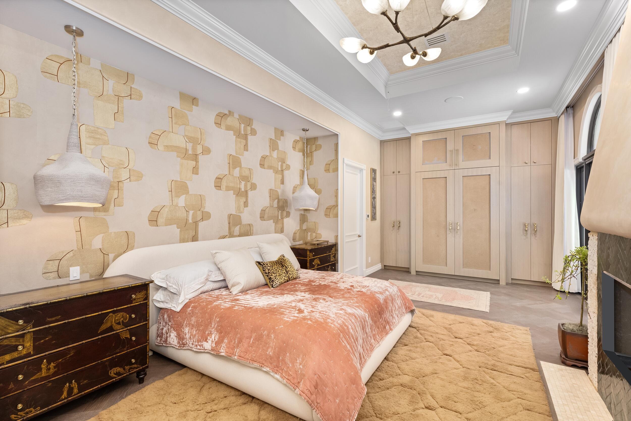 422 Addison Park Lane Boca Raton, FL 33432 - Photo 30 of 70 a bedroom with a bed and a chandelier