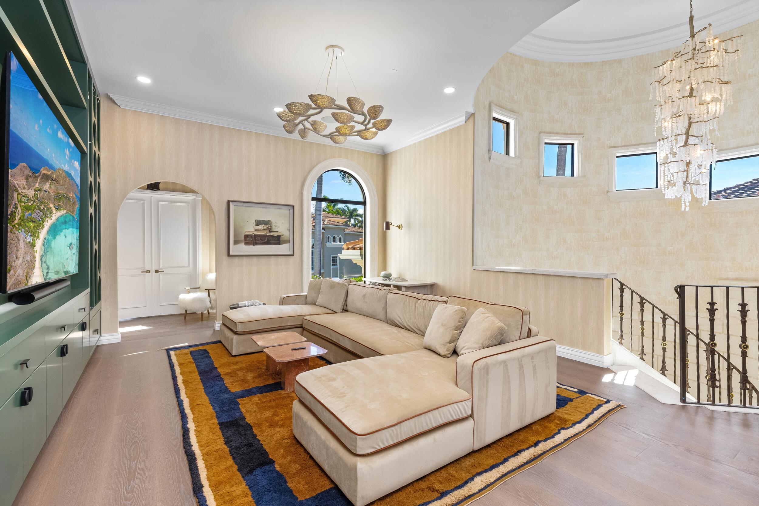 422 Addison Park Lane Boca Raton, FL 33432 - Photo 41 of 70 a living room with furniture chandelier and a flat screen tv