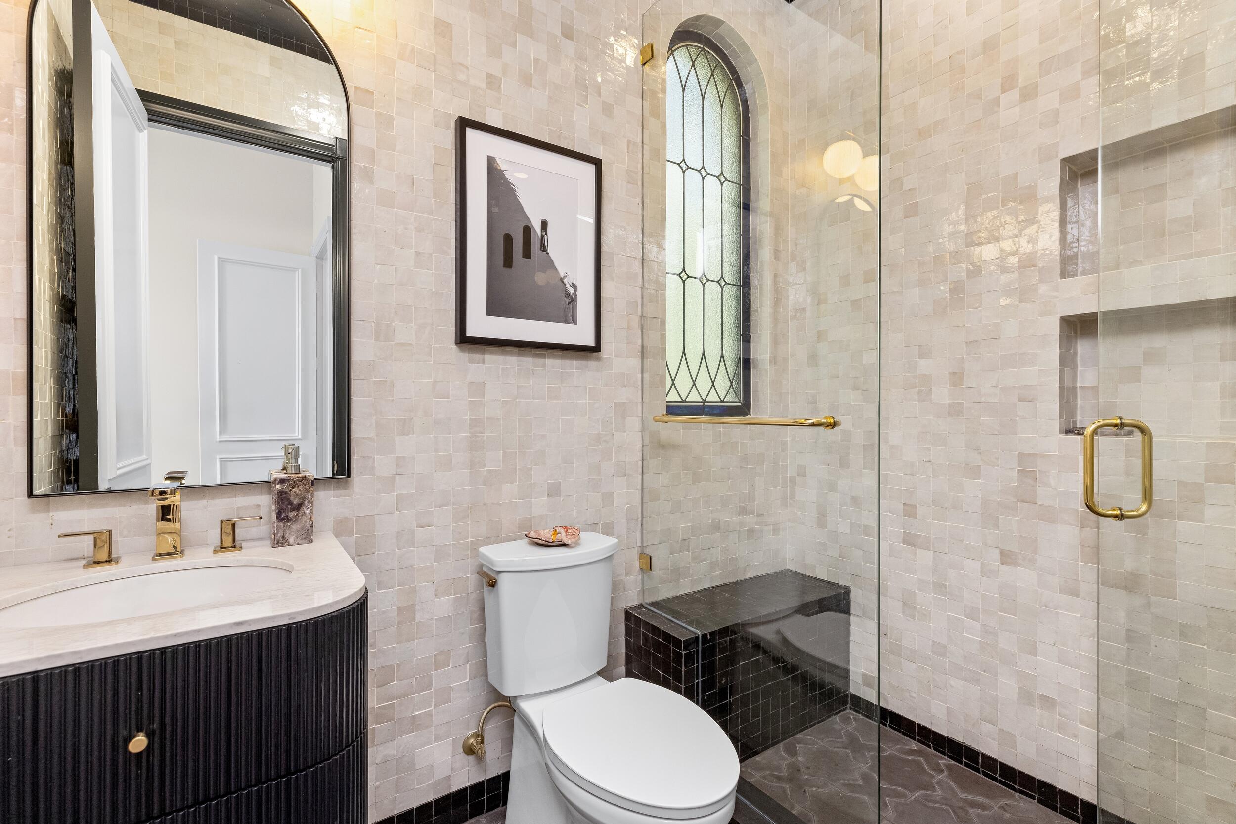 422 Addison Park Lane Boca Raton, FL 33432 - Photo 47 of 70 a bathroom with a granite countertop toilet sink and mirror