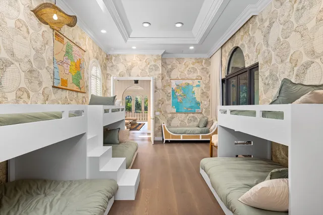 an aerial view of residential houses with outdoor space and swimming pool