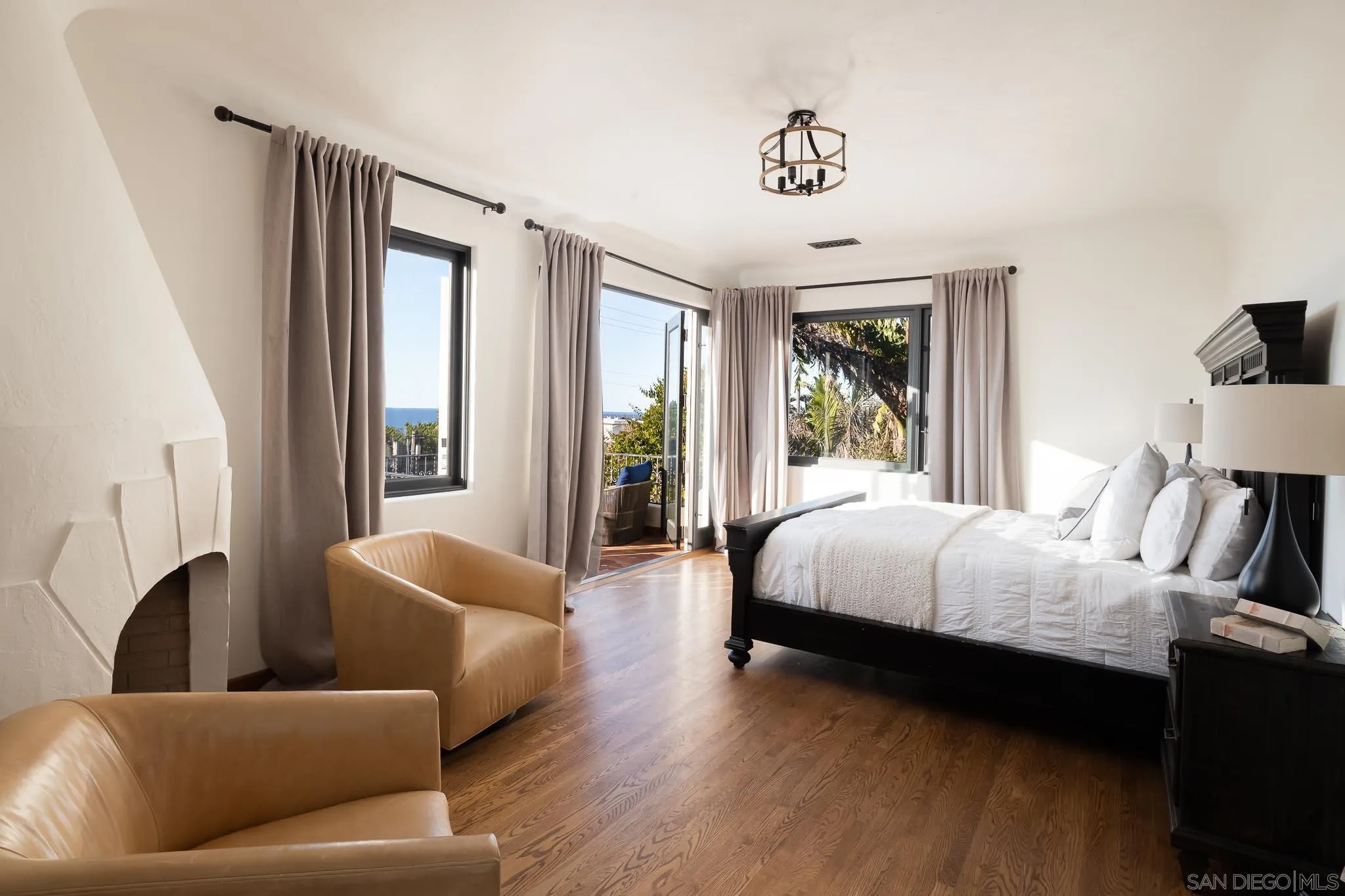 1004 Devonshire Drive San Diego, CA 92107 - Photo 25 of 54 a spacious bedroom with a bed couch and a window