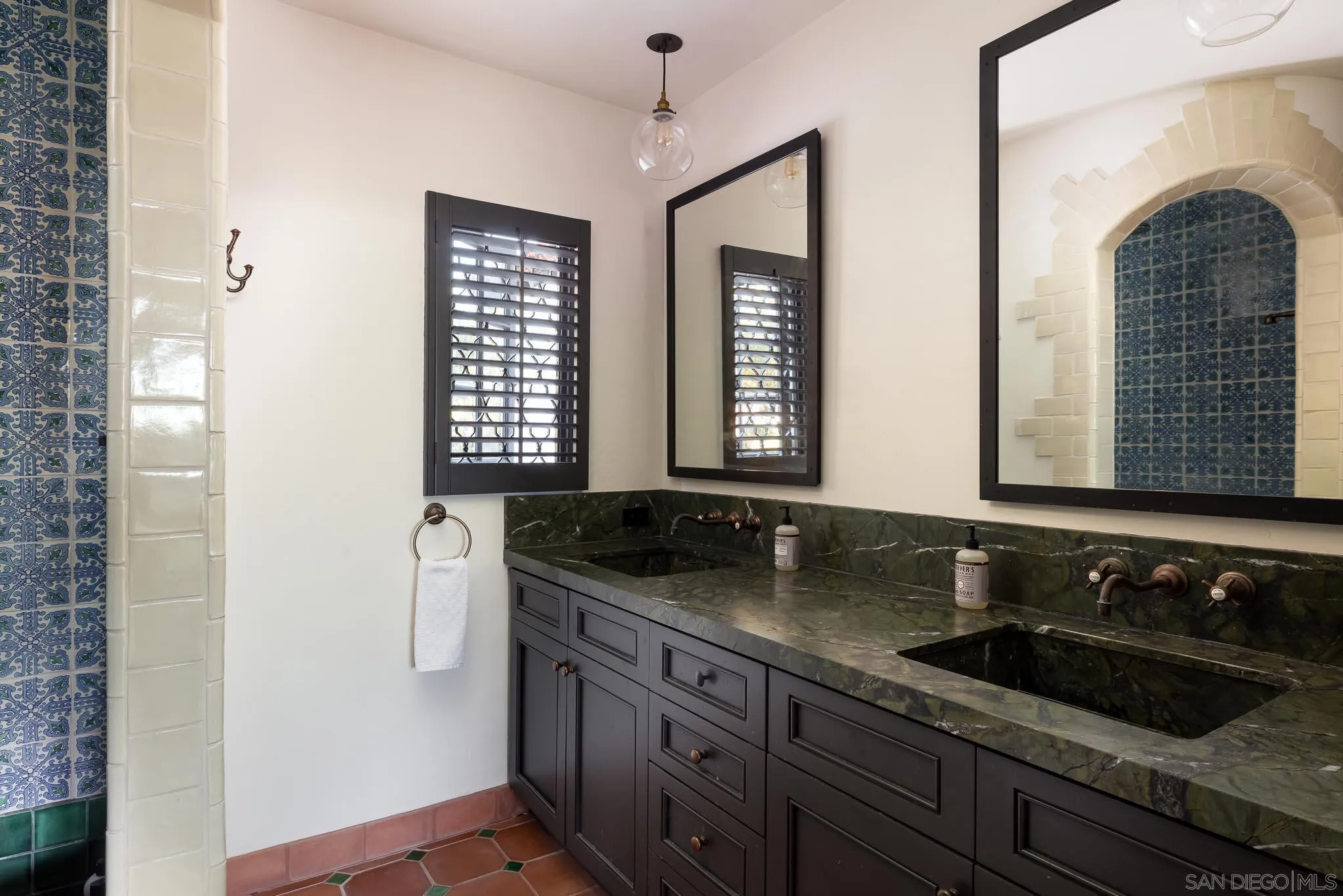 1004 Devonshire Drive San Diego, CA 92107 - Photo 34 of 54 a bathroom with a granite countertop sink and a mirror