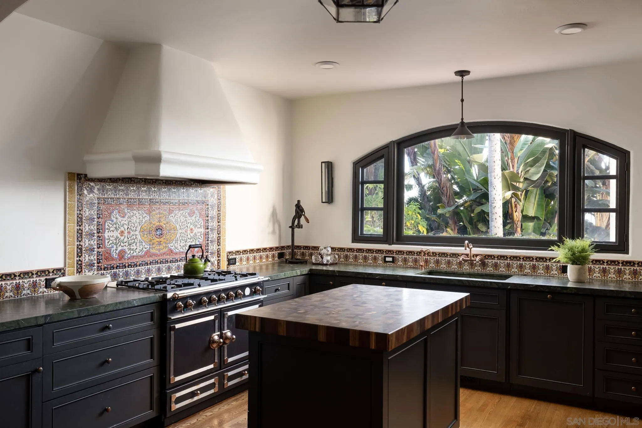 1004 Devonshire Drive San Diego, CA 92107 - Photo 10 of 54 a kitchen with a sink stove and cabinets