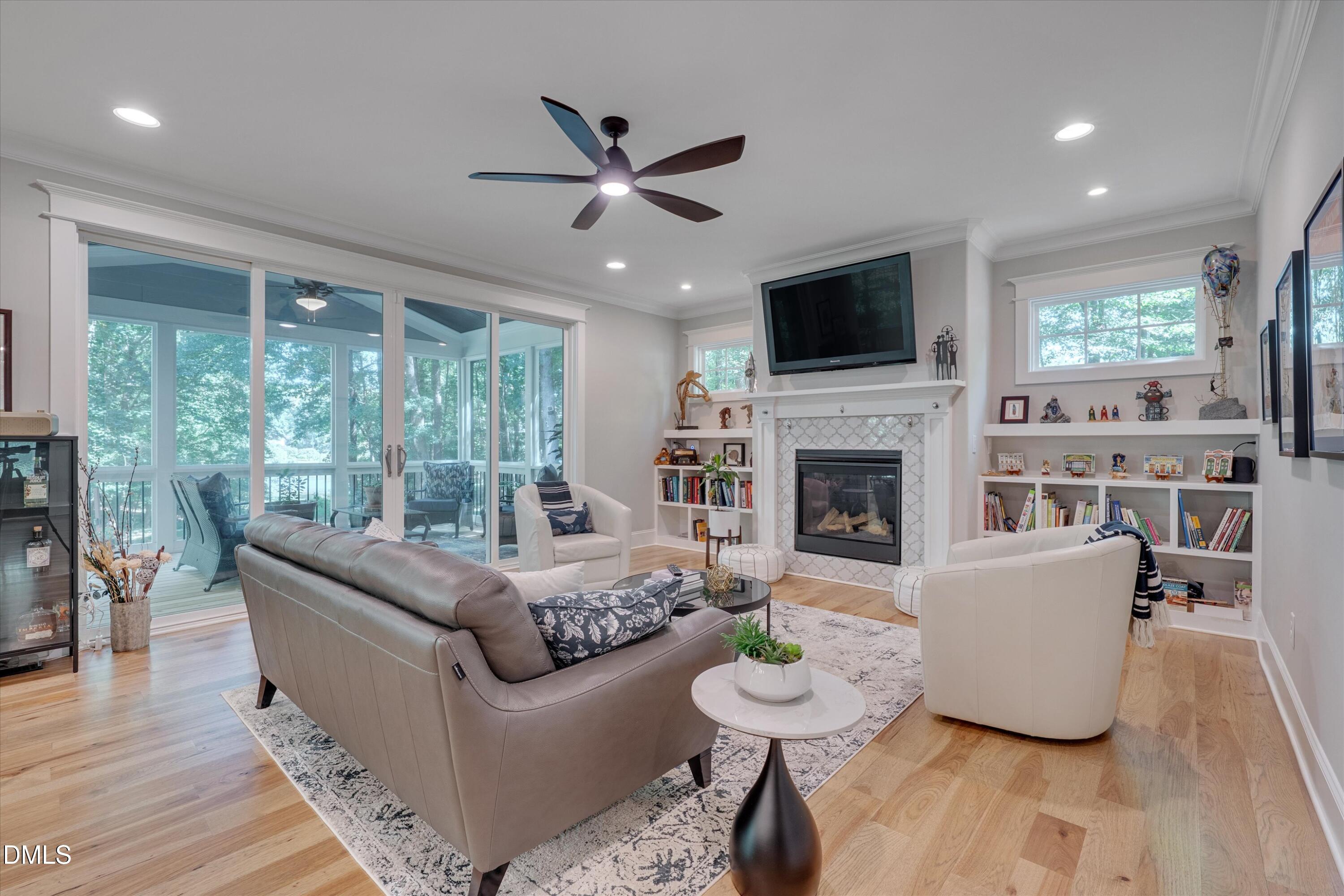 8601 Oneal Road Raleigh, NC 27613 - Photo 15 of 87 a living room with furniture fireplace and a flat screen tv