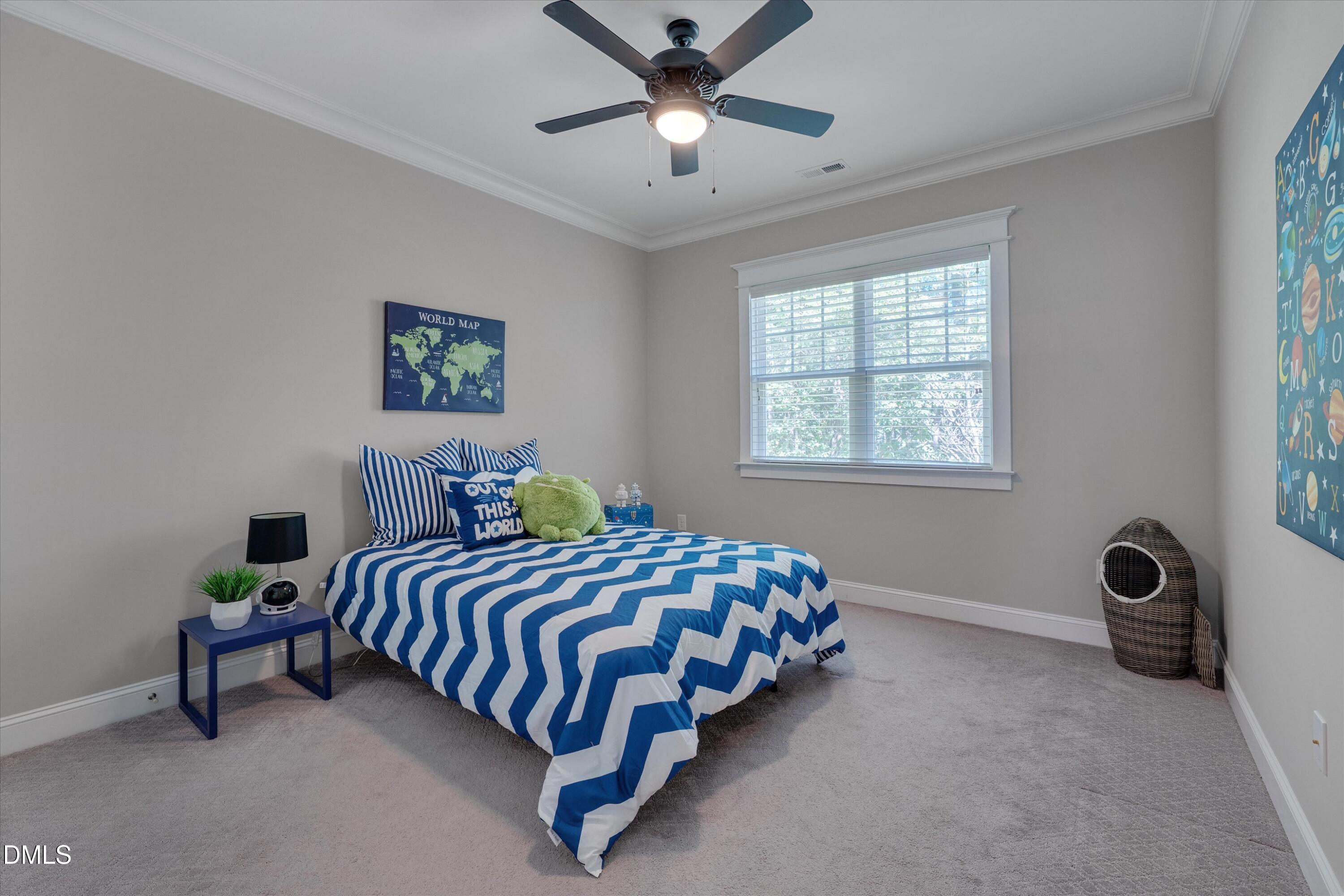 8601 Oneal Road Raleigh, NC 27613 - Photo 50 of 87 a bedroom with a bed and a window