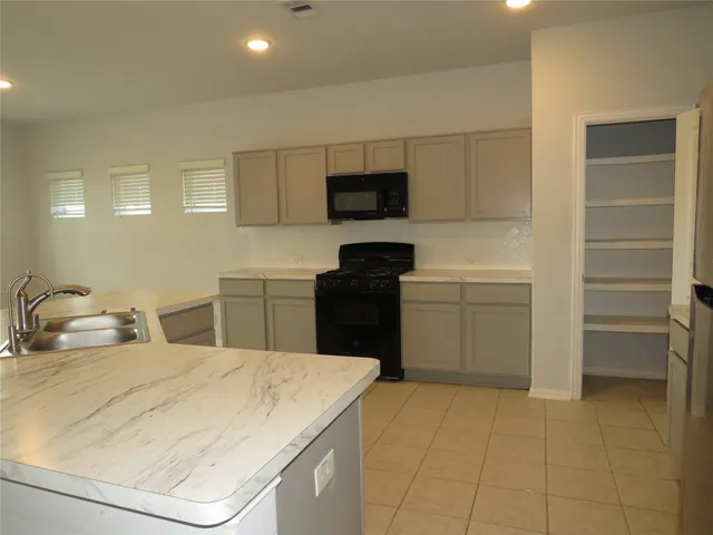 a bedroom with a bed and a television