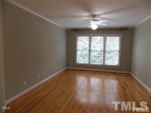 205 Berry Hill Drive Raleigh, NC 27615 - Photo 11 of 53 wooden floor in an empty room with a window