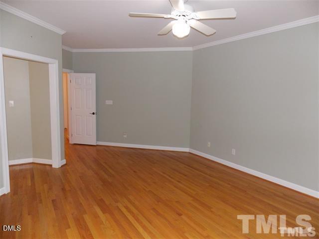 205 Berry Hill Drive Raleigh, NC 27615 - Photo 12 of 53 a view of an empty room with wooden floor