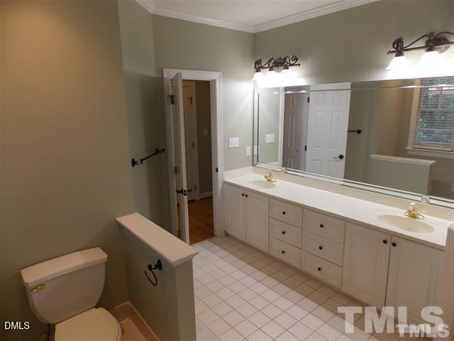 205 Berry Hill Drive Raleigh, NC 27615 - Photo 14 of 53 a bathroom with a double vanity sink mirror and toilet