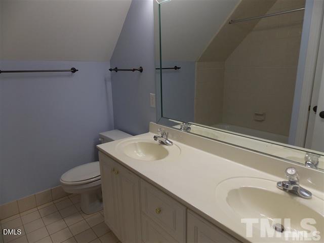 205 Berry Hill Drive Raleigh, NC 27615 - Photo 19 of 53 a bathroom with a sink and a toilet