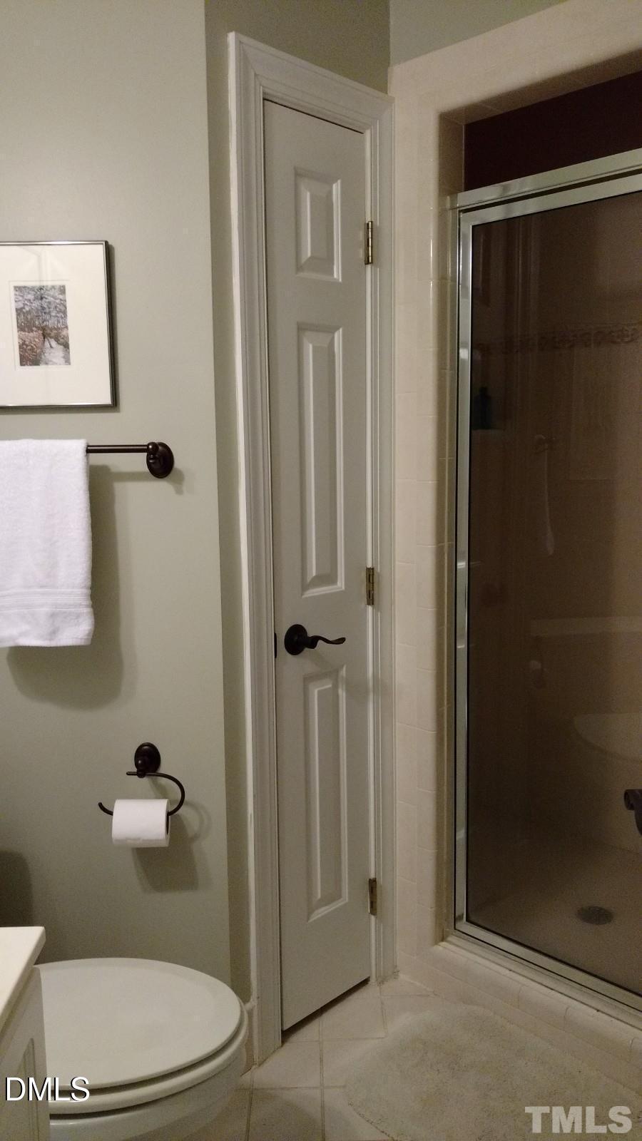 205 Berry Hill Drive Raleigh, NC 27615 - Photo 27 of 53 a bathroom with a toilet and a shower