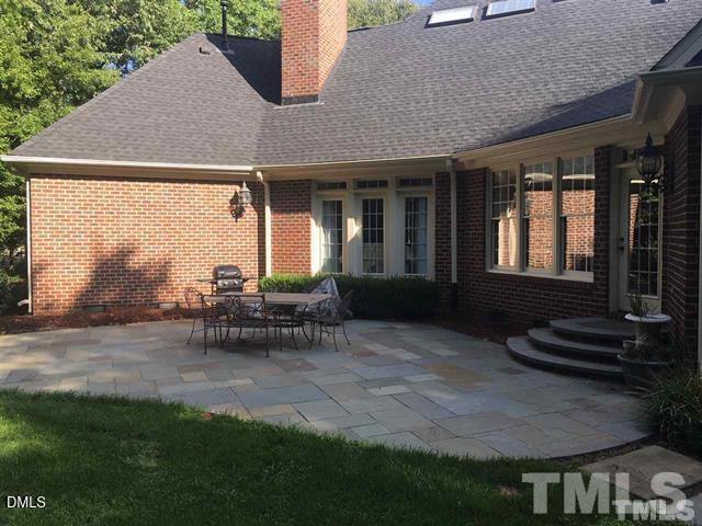 205 Berry Hill Drive Raleigh, NC 27615 - Photo 44 of 53 a view of house with backyard and outdoor seating