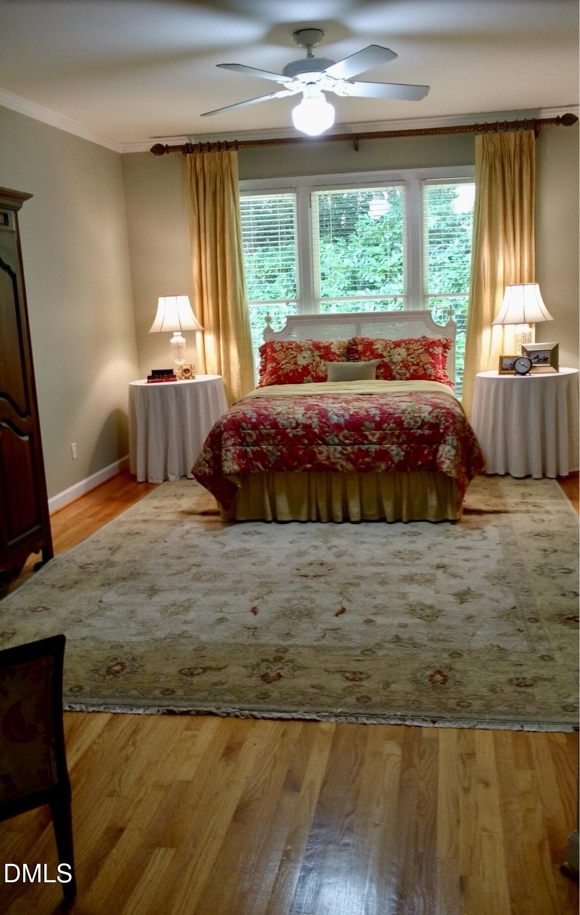 205 Berry Hill Drive Raleigh, NC 27615 - Photo 53 of 53 a large bed sitting in a bedroom next to a window