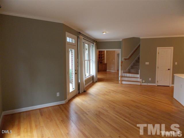 205 Berry Hill Drive Raleigh, NC 27615 - Photo 9 of 53 wooden floor in an empty room with a window
