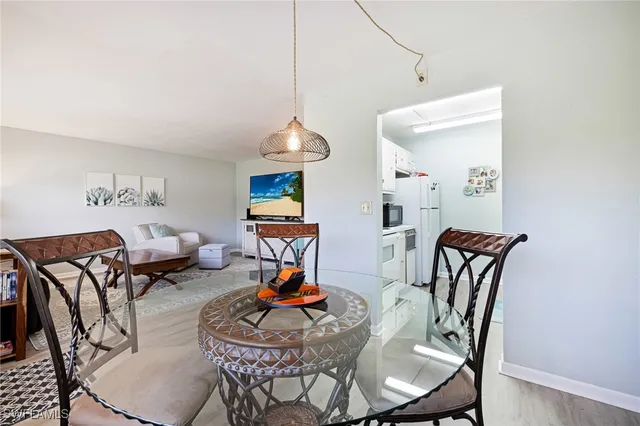 a living room with furniture a rug and a chandelier