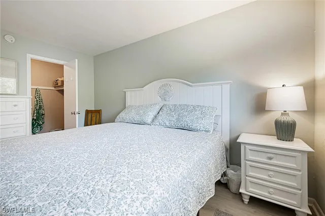 a bedroom with a bed and closet