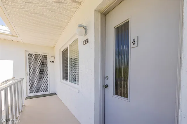 a view of a hallway with windows