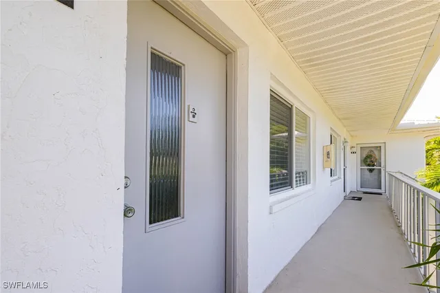 a view of a porch with wooden floor and stairs