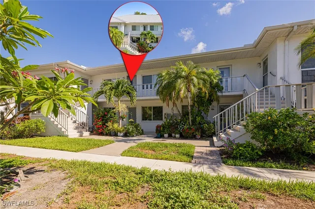 an aerial view of a house with a yard basket ball court and outdoor seating