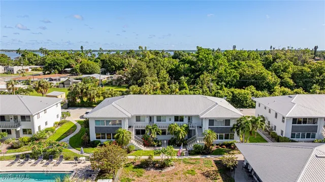 swimming pool with outdoor seating and trees