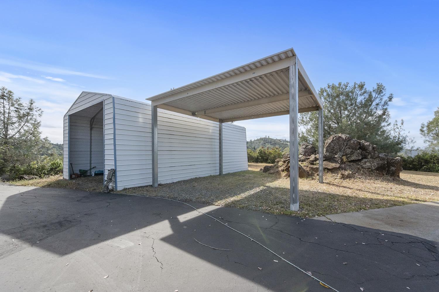 1261 Jurgens Road Rescue, CA 95672 - Photo 76 of 80 smaller home Covered RV parking and covered additional parking along with a 3 car garage.