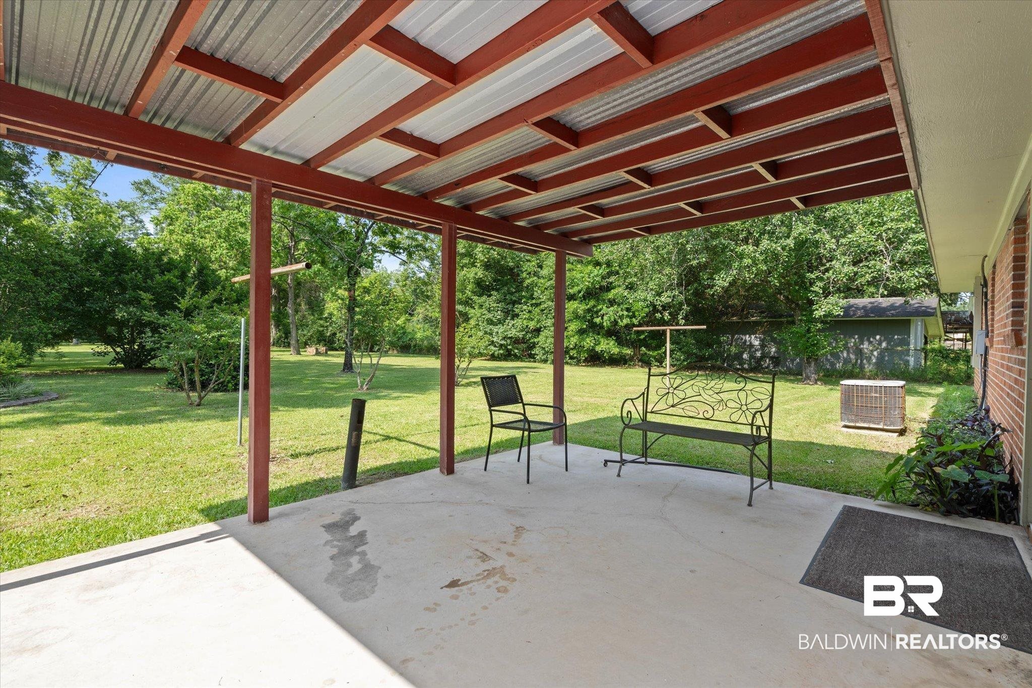 423 First Avenue Saraland, AL 36571 - Photo 17 of 20 View of patio / terrace with central AC and view of scattered trees