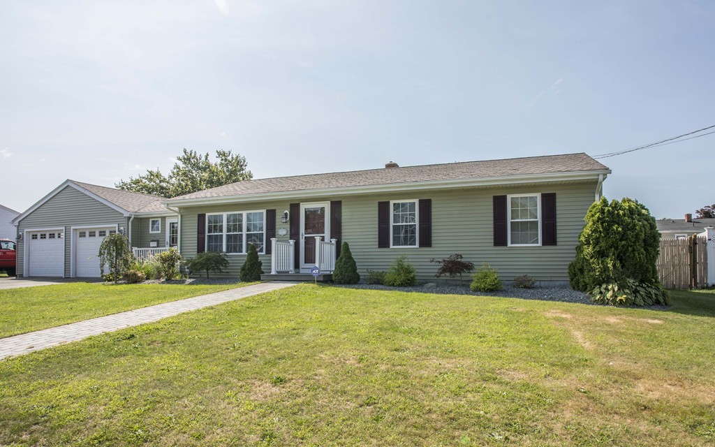 201 Riley Avenue Somerset, MA 02726 - Photo 1 of 22 a view of house with a big yard and potted plants