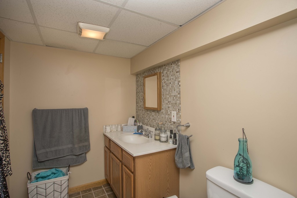 201 Riley Avenue Somerset, MA 02726 - Photo 19 of 22 a bathroom with a sink toilet and vanity