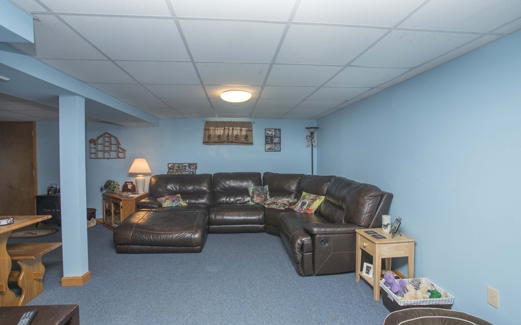 201 Riley Avenue Somerset, MA 02726 - Photo 20 of 22 a living room with furniture and a lamp