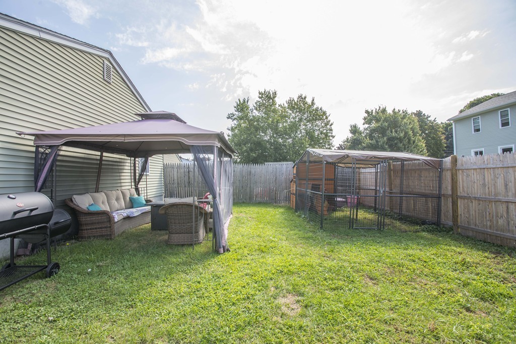 201 Riley Avenue Somerset, MA 02726 - Photo 5 of 22 a backyard of a house with outdoor seating