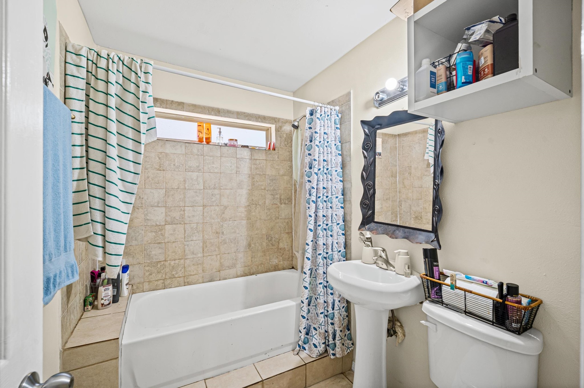 10621 Lane Street Houston, TX 77029 - Photo 26 of 29 a bathroom with a sink a toilet and shower