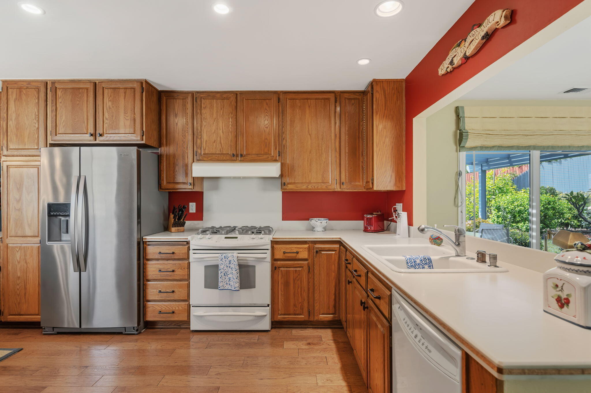 6020 Paseo Palmilla Goleta, CA 93117 - Photo 11 of 33 a kitchen with a sink stove and refrigerator