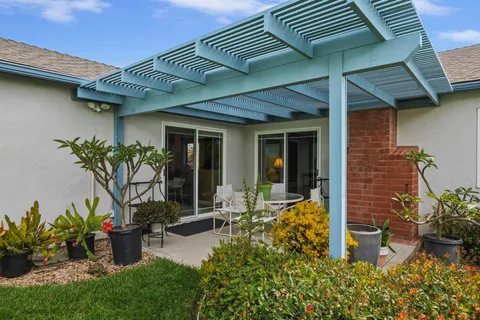 a front view of a house with patio