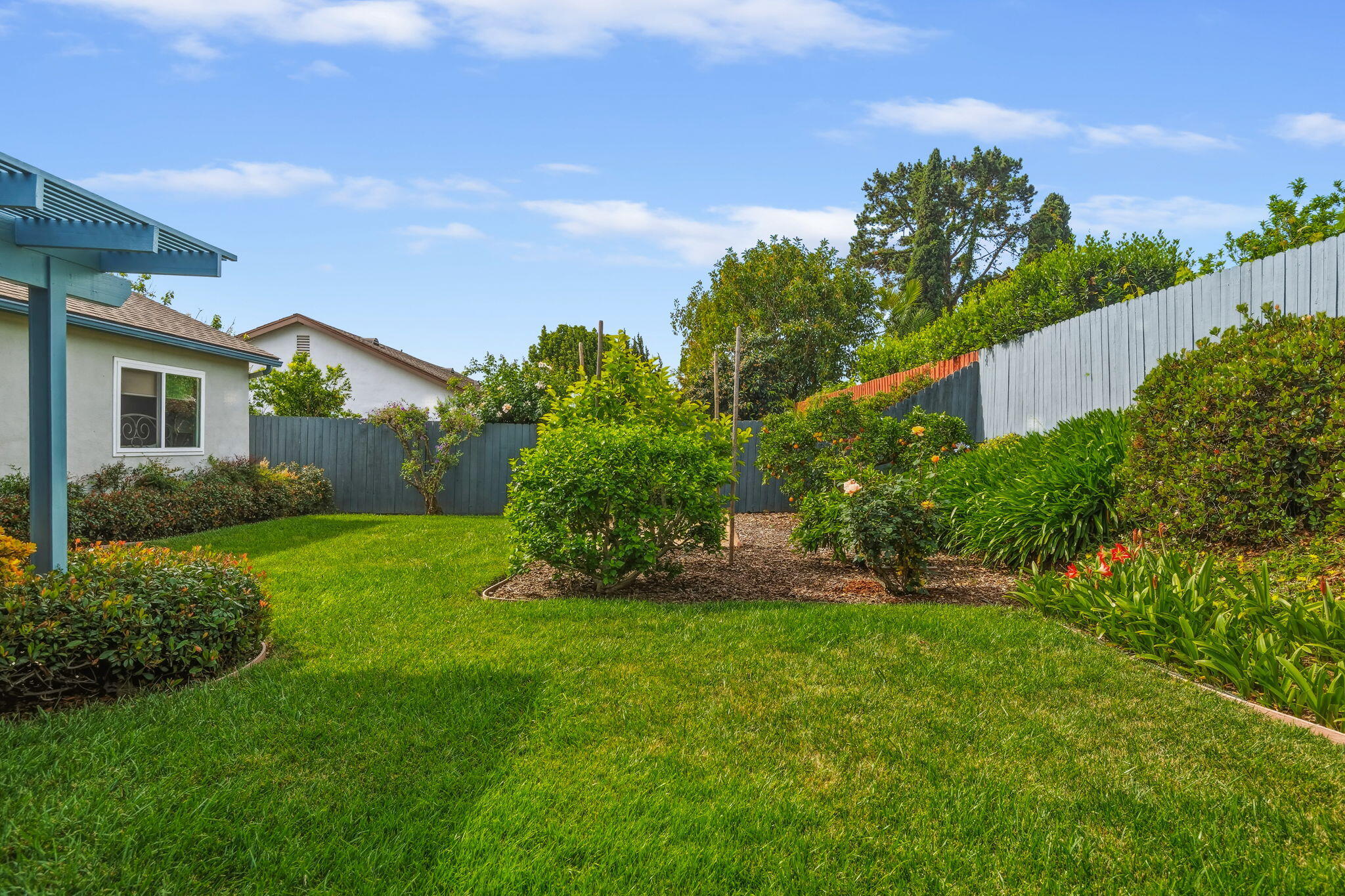 6020 Paseo Palmilla Goleta, CA 93117 - Photo 19 of 33 a view of a house with a big yard plants and large trees