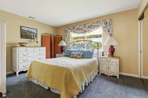 a bedroom with a bed and a cabinets